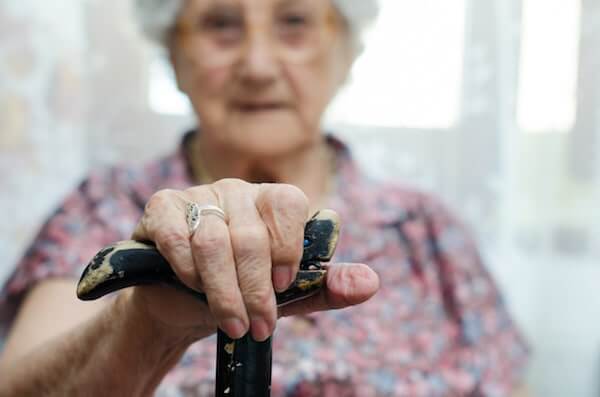 elderly woman with cane